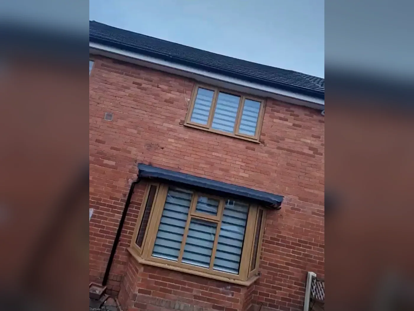 Reroofing project on a red brick house in Kirklees before and after — after