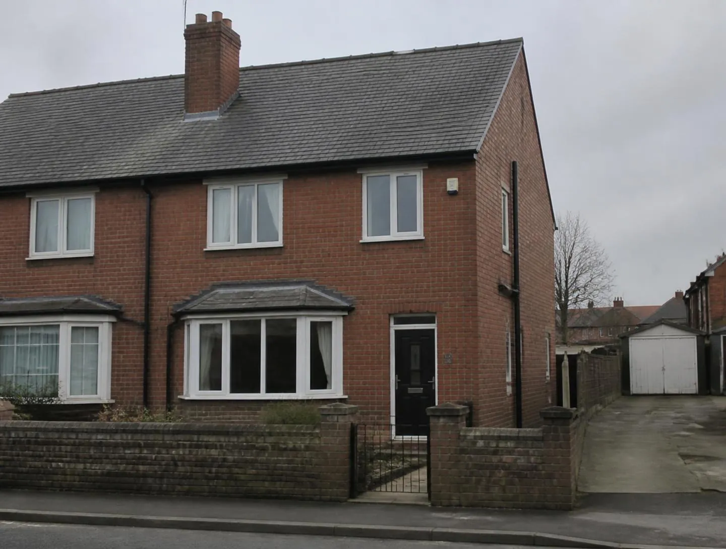 Scaffolding for roof replacement on a house in Mirfield — before